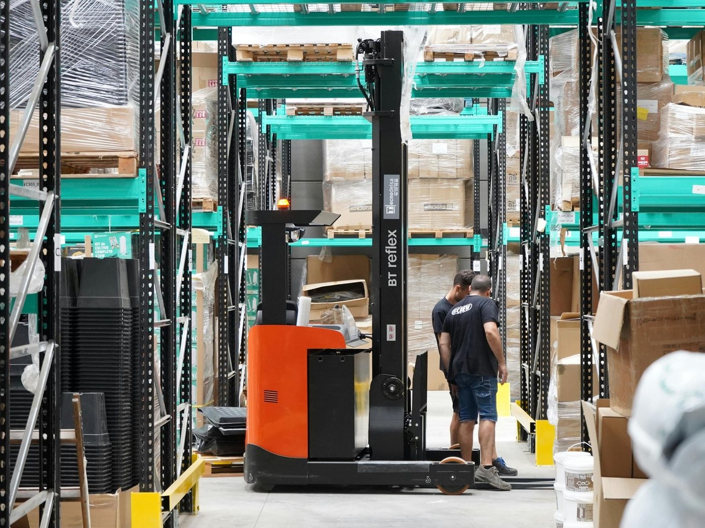 Warehouse storage and racking operations representing warehouse site selection, labor, truck access, and building fit
