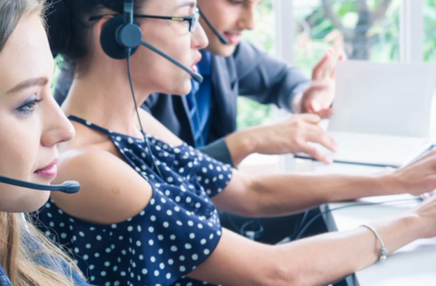 Call center agents on headsets